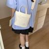 Bolsa Tote Cubo de Lona Casual Modelo Nuevo 2025 para Salir, Color Sólido de un Solo Hombro Nicho Ruiying Versión Coreana Bolsa Pequeña de Hombro Cruzada