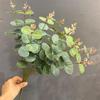 Nuevos productos en el mercado eucalipto de rama alta exhibición de decoración para el hogar hoja de dinero simulación planta verde paisajismo de hotel hoja al por mayor