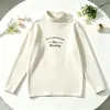 Estilo INS ropa para niños niños y niñas capa base ropa interior 2026 nueva ropa de invierno cuello semi-alto camiseta de manga larga para niños térmica forro polar grueso