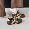 Superficie de cuero transpirable para mujer otoño 2026 suela blanda zapatos blancos zapatos de Forrest Gump zapatos de entrenamiento alemanes nuevos zapatos deportivos casuales para correr
