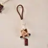 Madeira de nogueira criativa incrustada com pingentes de cachorro em formato de lingote esculpido, um pingente de chaveiro, um acessório de bolsa, um artesanato em madeira, fofo e divertido