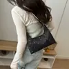 Modelo Nuevo Primavera 2026 Lentejuelas de Estrella Moda de Alto Estilo Bolso Casual Versátil Simple de Gran Capacidad para Hombro o Axila