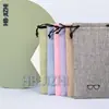 Bolsa para gafas negra cuerda de cordón de bisel suministro directo de fábrica bolsa para gafas de sol de tela compuesta accesorios coloridos para teléfono móvil bolsa de PU imprimible