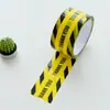 Fita de aviso com logo de marcação de decoração, cor de fundo amarelo, letras pretas, rolo grande, largura 4,8 cm, comprimento 25 metros