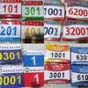 Los números de dorsal se producen para carreras de maratón coloridas, atletas de running y eventos deportivos escolares