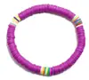 Pulseira de Contas Roxas com Listras Arco-Íris Coloridas Apresentando Material de Argila Suave para Conforto e Durabilidade Esta Pulseira Estilosa Oferece um Visual Divertido e Vibrante Perfeita para Adicionar Cor a Qualquer Roupa Casual