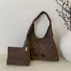 Bolso de axila de nicho para mujer 2026 Nuevo Otoño/Invierno Estilo coreano Moda Hueco Bolso de un solo hombro Versátil Bolso de mano para ir al trabajo