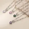 Collar transfronterizo europeo y americano de cobre chapado en oro de 18K con microincrustaciones de diamantes de colores en forma de corazón y lazo para mujer, dulce y versátil, venta al por mayor