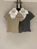 Wgwe10199 Roupas Femininas Shisanxing de Guangzhou Verão 2026 Novo Top Camiseta Manga Curta Color Block Gola V Falso Duas Peças