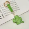 Chaveiro de Carro com Pingente de Trevo de Quatro Folhas da Sorte em Argila Cerâmica Full Strass Transfronteiriço Pingente para Bolsa de Casal de Luxo Pequeno Ornamento Criativo
