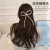 Pinza para el pelo de lazo de perla dulce y elegante, pinza superior de temperamento femenino, pinza de resorte para la parte posterior de la cabeza, accesorios para el cabello con sentido avanzado