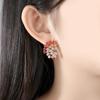 Pendientes de circonita de colores mixtos con orejas exageradas de estilo europeo y americano de Jinse, nuevos pendientes coreanos con gradiente de temperamento dulce para banquetes.