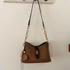 Bolso de mano de diseño nicho estilo coreano transfronterizo para mujer, moderno, simple, color liso, texturizado, elegante, bandolera y de hombro vintage
