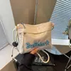 Bolso de Niña Verano 2026 Nuevo Bolso Cruzado de un Solo Hombro Estilo Deportivo Lindo Portátil de Alta Gama Bolso Cuadrado Pequeño