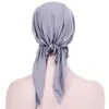 AliExpress nuevo gorro de punto de color liso con dos pompones de arco europeo y americano en stock
