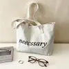 Bolso de hombro casual de lona con estampado de letras estilo ins coreano para mujer, nuevo modelo 2026, bolso tote de gran capacidad