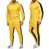 Conjunto de sudadera con capucha para hombre transfronterizo, conjunto casual deportivo de dos piezas para primavera y otoño, pantalones de rayas con bloques de color, ropa de hombre para comercio exterior