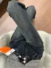 Jeans Americanos de Tiro Bajo Elásticos Micro-Acampanados 2026 Primavera Azul-Gris Diseño de Doble Botonadura Pantalones Micro-Acampanados de Largo hasta el Suelo