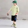 Conjunto de Verano para Niños 2026 Estilo Nuevo Ropa Deportiva Casual Elegante Camiseta de Manga Corta con Letras y Pantalones Cargo Conjunto de Dos Piezas 8