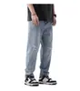 Venta al por mayor de ropa para hombre Xintang: Jeans retro nuevos de primavera para hombre, estilo harén holgado, marca de moda con rotos, pantalones largos de primavera