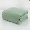 Toalla de baño de forro polar de coral engrosada y ampliada color liso 105*200 toalla envolvente de absorción de agua para adultos transfronteriza se puede etiquetar