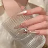 Puntas de Uñas Estilo Dulce de Verano Transparente Color Nude Ojo de Gato con Pedrería, Puras y Atractivas, Efecto Iluminador, Sensación de Alta Gama, Longitud Media, Pegatinas para Uñas Deslumbrantes