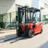 Carretilla elevadora eléctrica de cuatro ruedas para montar, batería de litio, manejo y elevación eléctricos, apilador hidráulico de dos toneladas para carga y descarga