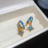 Nuevos pendientes de estilo europeo y americano con aguja de plata y detalles de diamantes en forma de cruz C, pendientes de diseño único, modernos y versátiles para el uso diario