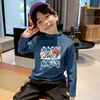Capa base térmica de forro polar para niños 2026 Otoño/Invierno Nuevo estilo Camiseta versátil de manga larga para niños Camiseta interior de cuello semi-alto para niños
