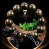 Pulsera de cuentas de Buda Jin Sinan madera sombría material viejo veta Shun ojo de gato pulsera Jin Sinan puesto de mayoreo regalos más vendidos
