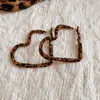 Pendientes Retro Europeos y Americanos de Otoño e Invierno con Estampado Geométrico de Leopardo en Piel Lujo Accesible Pendientes de Gama Alta Pendientes de Moda Elegantes y con Estilo para Mujer