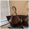 Bolsa de mano grande transfronteriza para mujer, nueva moda otoño 2026, bolso de hombro, elegante y versátil para el trabajo y los desplazamientos