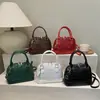 Bolso de Mujer de Moda Transfronterizo con Textura 2026 Nuevo Patrón de Cocodrilo Forma de Concha Bolso de Hombro Versátil para Debajo del Brazo Bolso de Mano para Mujer
