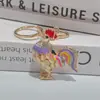 Zodíaco Europeo y Americano Pollo Llavero Paquete Colgante Metal Fase Gallo Dorado Esta Vida Zodíaco Colgante Llave Gallo Creativo Transfronterizo