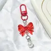 Llavero de lazo colorido con perlas, accesorios hechos a mano para fundas de teléfono, audífonos, bolsos y accesorios de ropa