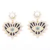 Pendientes de aleación con incrustaciones de perlas y diamantes, con temperamento de moda transfronteriza europea y americana, creativos de lujo ligero, con forma de corazón y ojo de ángel