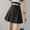 Saia curta simples de cintura alta para mulheres, primavera/verão, saia plissada de uniforme JK de cor sólida, saia-calça anti-exposição, saia midi evasê