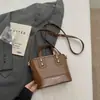 Bolso de hombro bolso elegante mujer versátil bloques de color bolso cruzado de mano 2026 hombro único cubo nuevo nicho exquisito para commuting