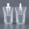 En stock bolsa auto-soportante transparente para líquidos con boquilla de succión bolsa para cerveza diámetro grande a prueba de fugas bolsa desechable para leche de soya bolsa para medicina tradicional china