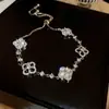 Pulsera de cristal con cuentas de flor de circón fresco, pulsera de lujo ligero de alta gama, joyería pequeña dulce versátil al por mayor