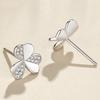 Elegantes aretes de trébol de moda 2023 nueva tendencia aretes giratorios de hierba de tres hojas incrustados de diamantes