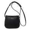 Bolsa popular para mujer 2025, nueva bolsa de hombro de color liso, moda casual simple, nicho, bolsa cruzada tipo cubo