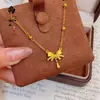 Tienda de Oro Mismo Estilo Collar de Corazón Picado Chapado en Oro Alta Retención de Color Floral Mariposa Moneda de los Cinco Emperadores Collar Venta al por Mayor