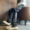 Pantalones de ajuste limpio color Negro Puro Sentido del Diseño Cremallera Dividida Ambiente Estilo Americano Pantalones Funcionales de Carga Rectos Micro-pantalones
