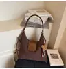 Bolsa Tote para Trajeto Transfronteiriço para Mulheres 2026 Nova Mochila de Grande Capacidade Versátil Casual Nicho Bolsa de Ombro Bolsa Transversal