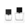 Botella de perfume de vidrio con forma de bayoneta de 50 ml, venta al por mayor, botella con atomizador cuadrada transparente de 100 ml con tapa de madera de loto negro.