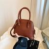 Bolsas de Mujer de Alta Gama Transfronterizas de Nicho Otoño/Invierno 2026 Nuevo Bolso Cruzado de Moda Vintage Popular Bolso de Mano Pequeño con Forma de Concha