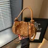 Bolso de hombro para mujer estilo coreano, dulce, de lunares, para axila, nuevo bolso de mano pequeño de moda verano 2026, versátil para el trabajo y los desplazamientos