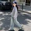 Conjunto de otoño estilo universitario para niñas 2026 nuevo conjunto de dos piezas de moda para niños mayores, con una sudadera de imitación de dos piezas y jeans
