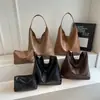 Bolsa feminina retrô de grande capacidade 2026 nova bolsa casual de ombro/axila com um estilo descontraído e relaxado para o trajeto